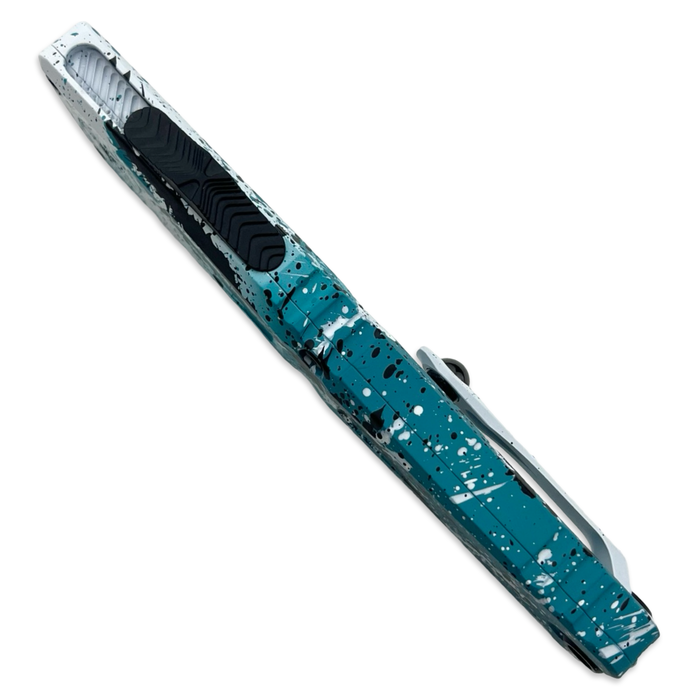 Microtech 1143-1TQWHBKSPLS - Combat Troodon S/E Gen III Signature Series Turquoise/White Black Splatter Standard